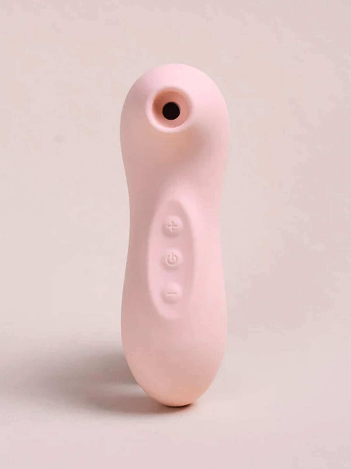 Serene Air Pulse Wellness Massager in ergonomic rose gold and white medical-grade silicone