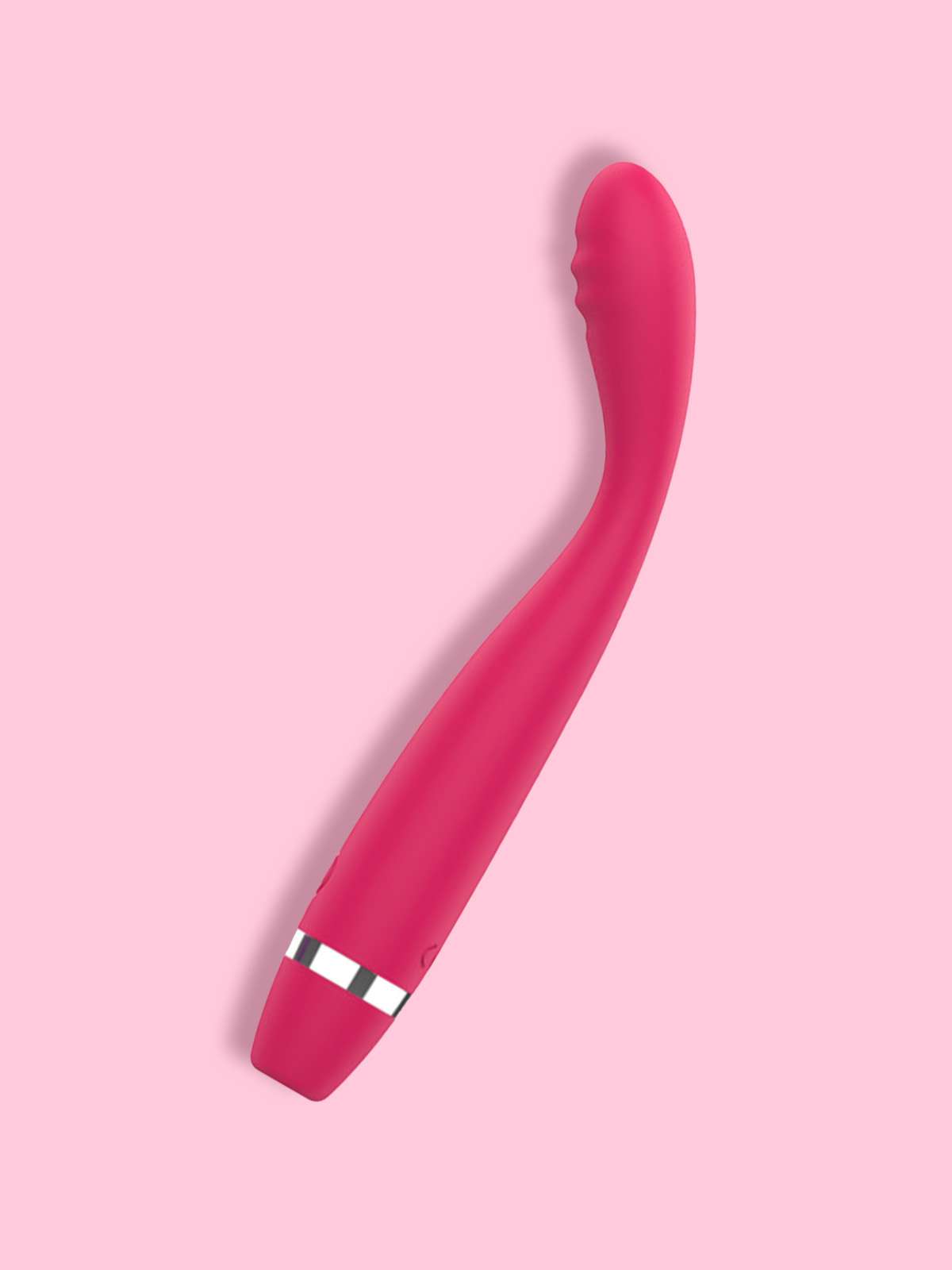 A hot pink curved G-spot vibrator with an ergonomic tip and silver accent band on a soft pink background