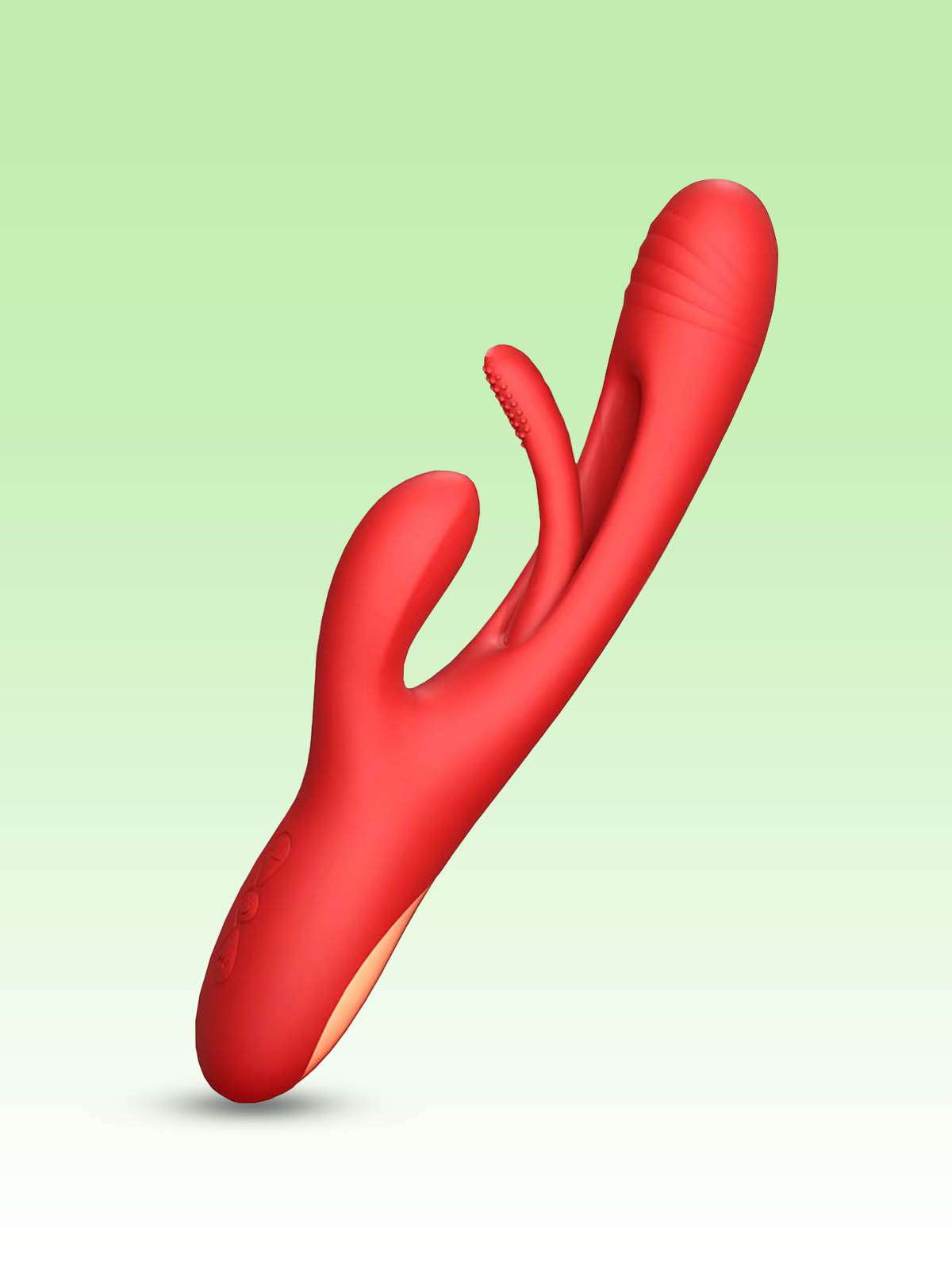 Radiant red triple-stimulation silicone rabbit vibrator with rose gold base, demonstrating distinct shafts for G-spot, clitoral, and perineum/anal stimulation areas on a light green background.