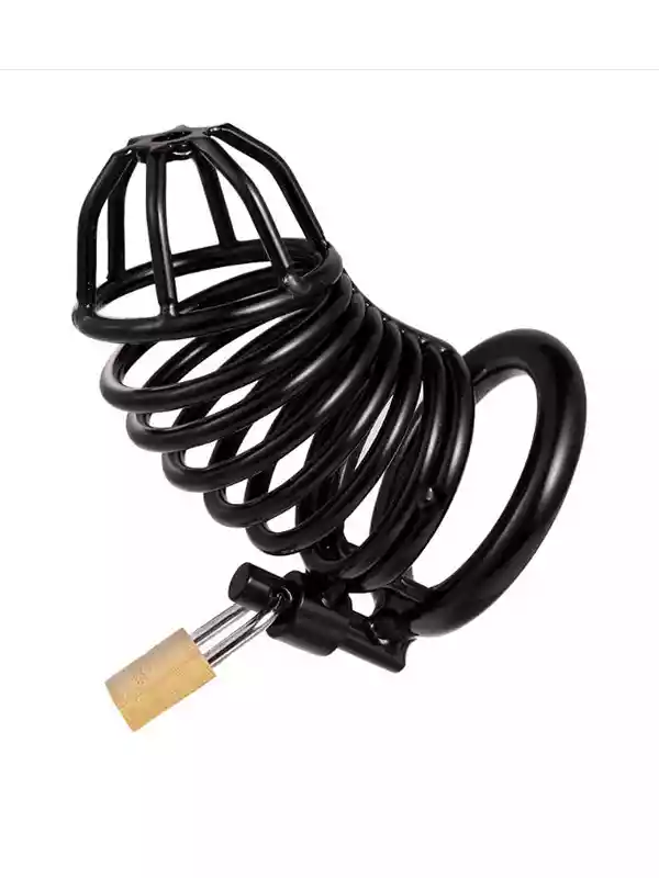 Close-up view of a matte black metal chastity cage featuring an ergonomic ventilation grid and a secured brass padlock on the locking ring, displayed against a pink background.