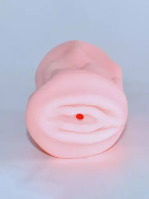 Soft flesh-tone pocket egg masturbator with a tight, ridged textured opening